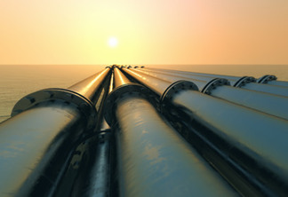 Tubes running in the direction of the setting sun. Pipeline transportation is most common way of transporting goods such as Oil, natural gas or water on long distances.